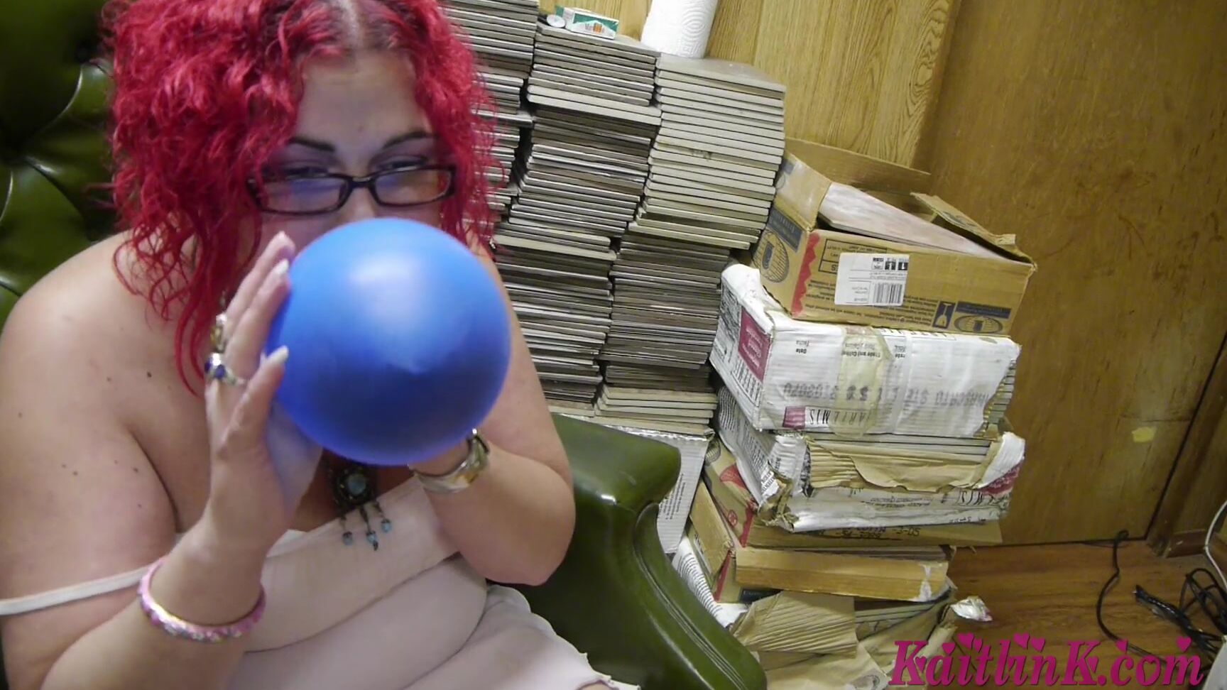 Kaitlink Eden Blows Up A Blue And Red Balloon