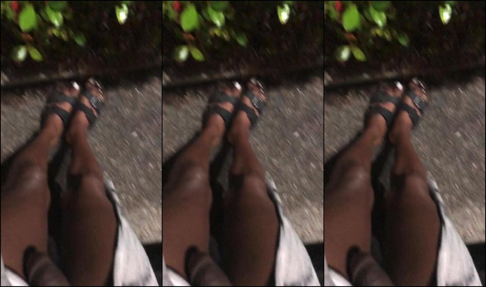 Publicprincess Sitting At A Bus Stop While A Trucker Watches