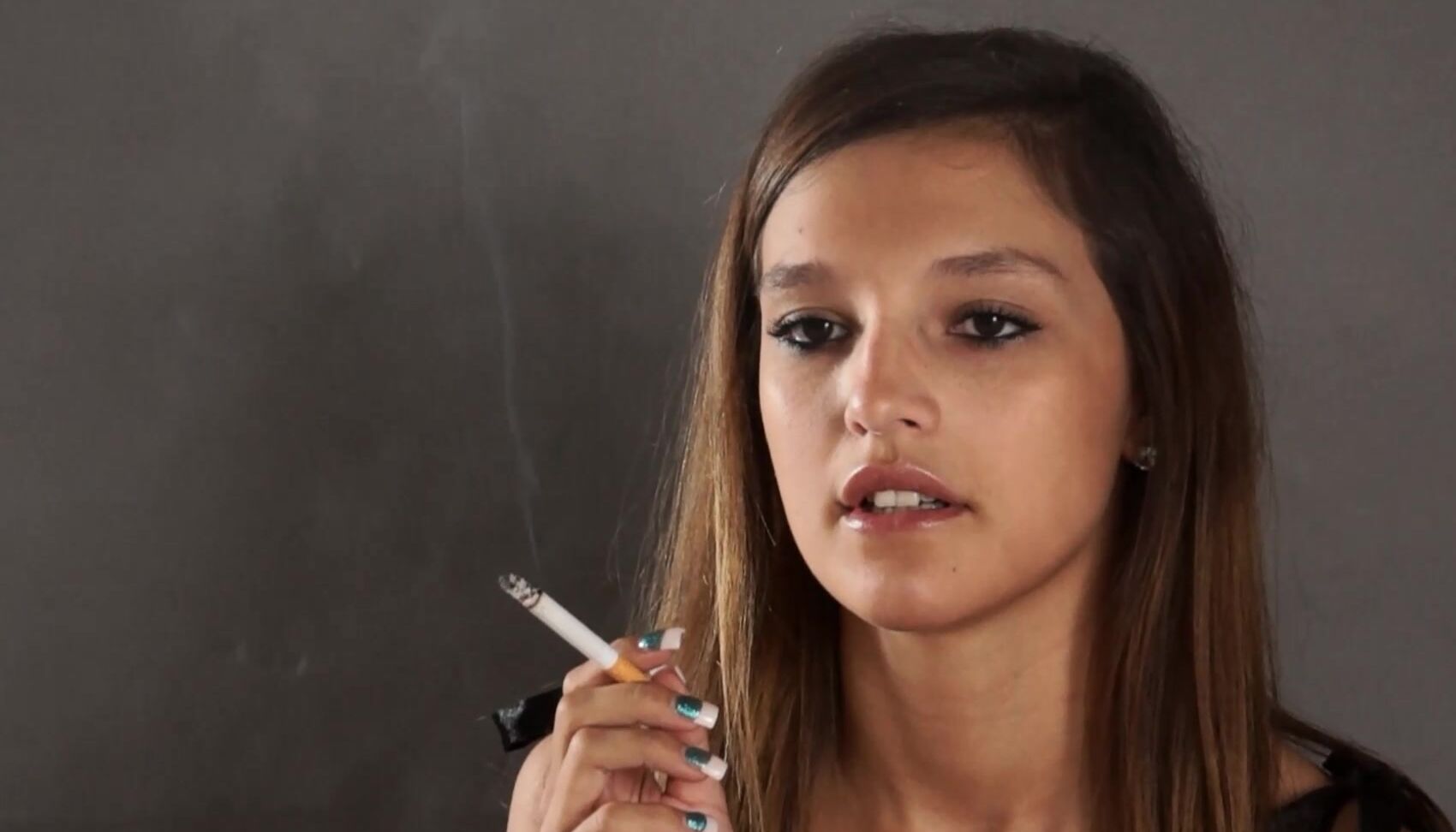 Custom Fetish Danielle Smokes A Marlboro On Grey